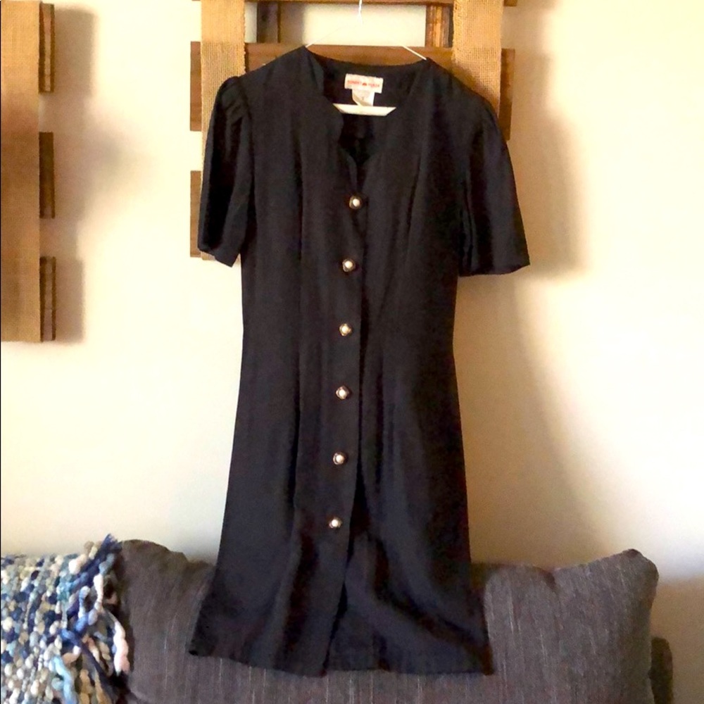 Chic black dress with pearl buttons